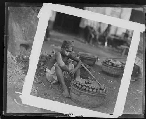 Seated child with tools