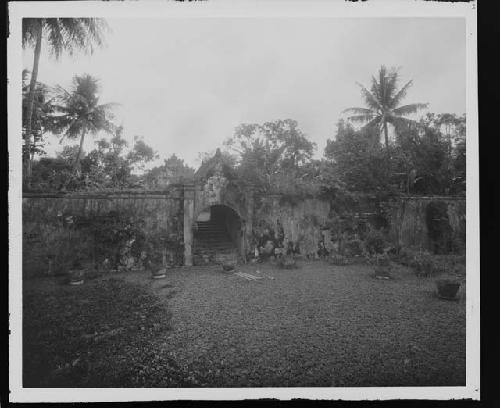 Ruins of wall and stairway in jungle setting