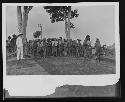 Group of men with tools in rural setting