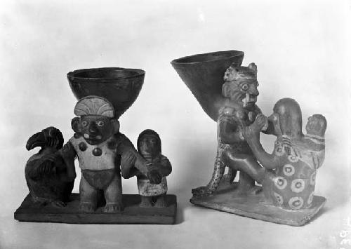 Double spouted pottery vessel depicting priest and women