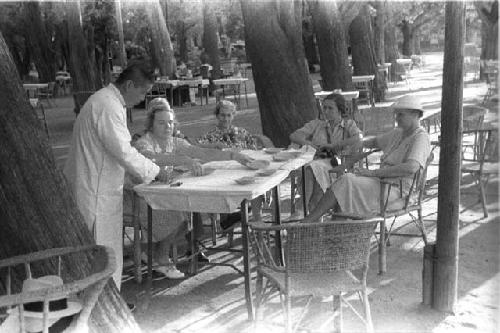 Eleanor Larrimore, older man and three women sitting at table