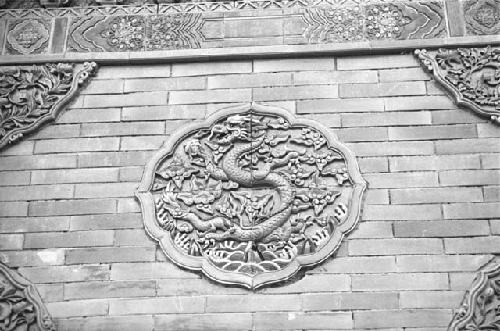 Close-up of carving with lotus on wall