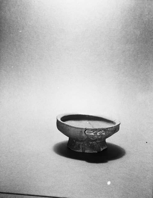Small grey bowl with effigy handle and flaring base, from grave 26, number 272