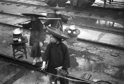 Peasant women selling food, railway station