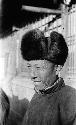Portrait of a Chinese man wearing a fur hat