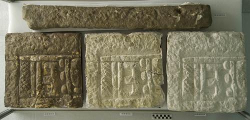 Cast of carving around base of Stela N, border from glyph band