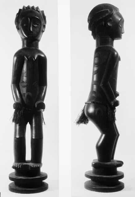 Human figurine of wood, female idol with apron skirt