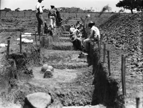 View of excavation I-31 showing stone section 1 and pottery