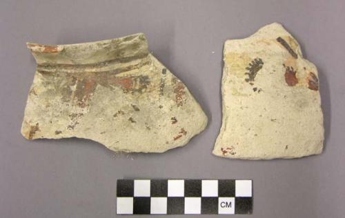 Ceramic sherds, one body, one flared rim sherd of jar, polychrome exterior, buff