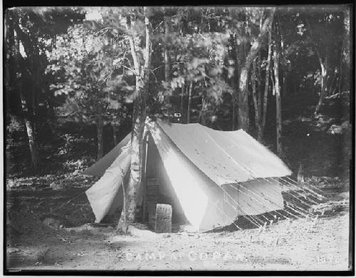 Camp tent with artifacts in the opening