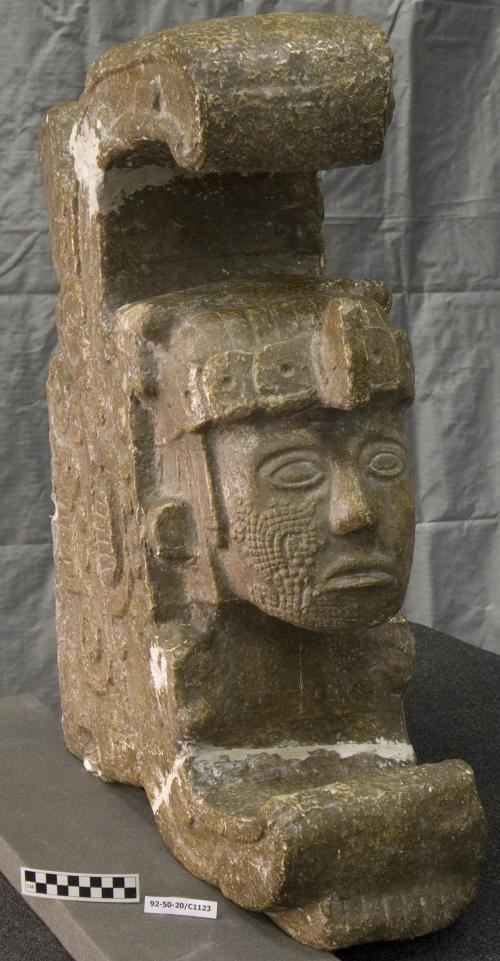 Cast of corner serpent sculpture with anthropomorphic head in mouth