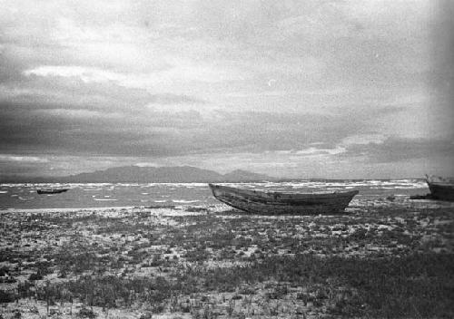 Boats by seashore