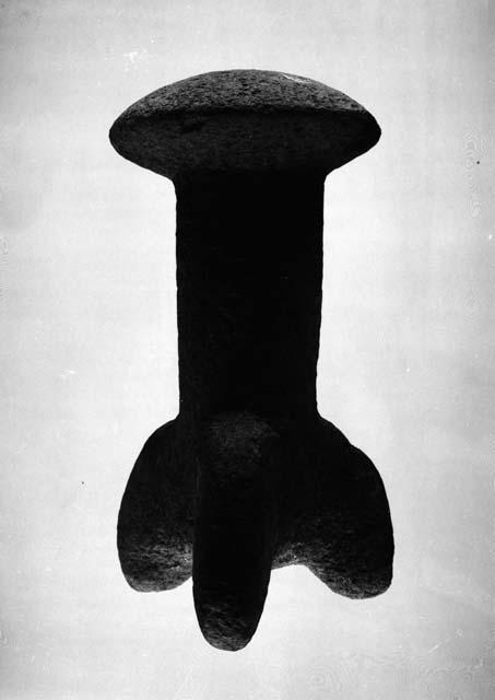 Stool shaped object of stone with three legs and a mushroom-shaped top