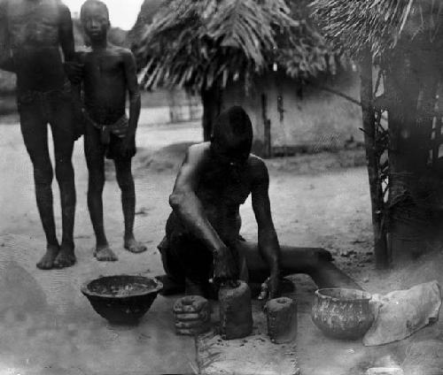 Man making anklet molds