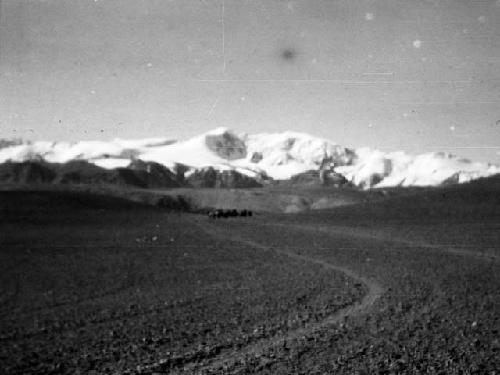 Depsang Plains, vast plain with caravan in far distance and mountains