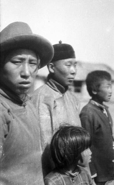 Fish skins, two adults, two children close-up