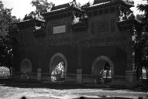 Large ornately carved gateway with three arches