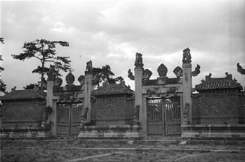 Ornate wall and gate with carved panels