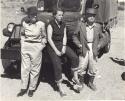 Lorna Marshall, Elizabeth Thomas Marshall and L. F. Maingard standing next to an expedition truck
