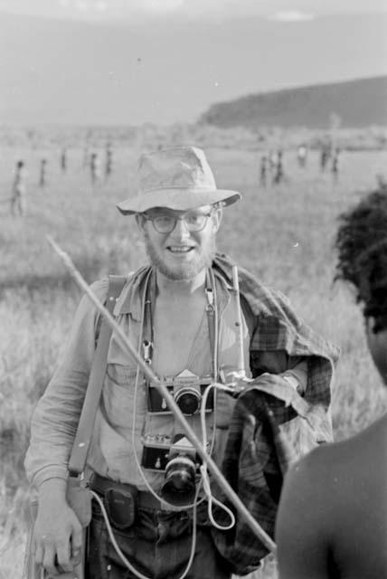 Michael Rockefeller, frontal, two cameras around neck