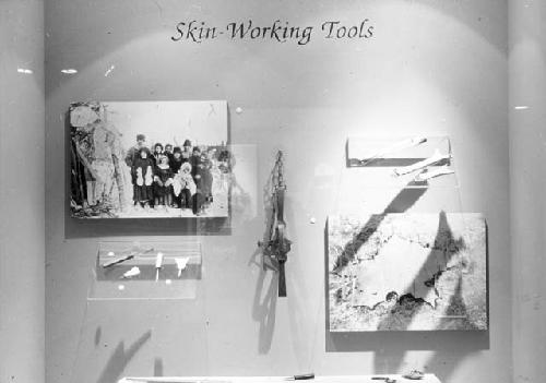 Exhibit case containing skin-working tools