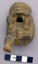 Ceramic figurine whistle of standing anthropomorph,
