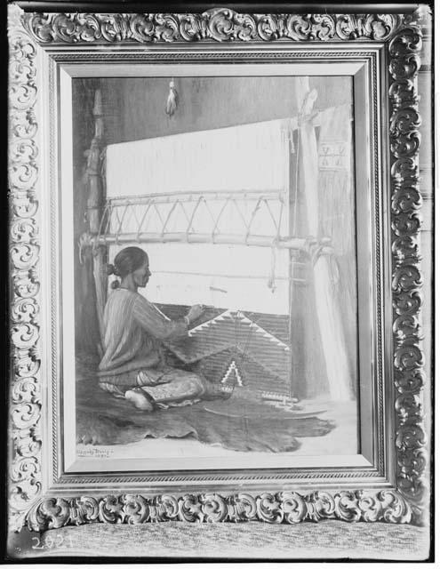 Navajo woman weaving inside hogan