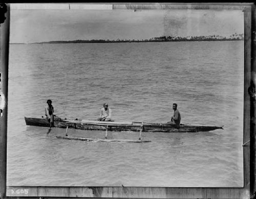 Three people on canoe, Funafuti island