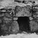 Entrance into tomb under central bench in east room, Str S133b