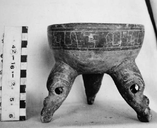 Tripodal dichrome, incised bowl.