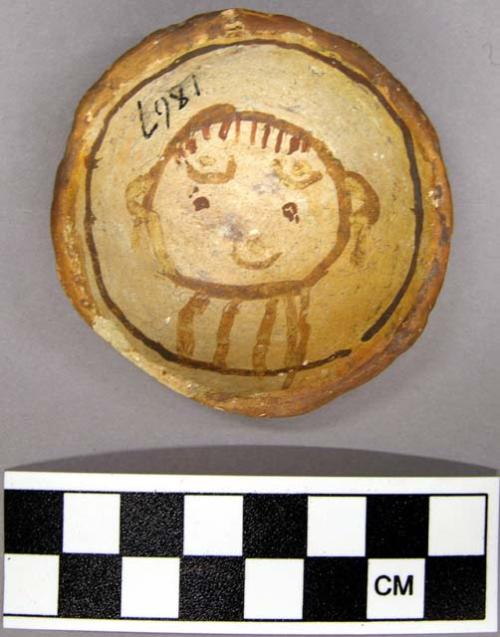 Bowl, polacca polychrome style c. int: clown design; ext: slipped, no design. 1.