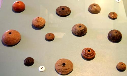 Terra cotta spindle whorls