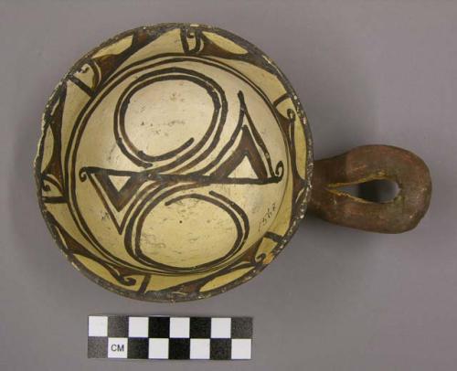 Ladle, Polacca polychrome style c. int: zuni rain bird design; ext: slipped