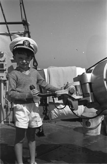 David Lattimore in sailor's cap on ship deck