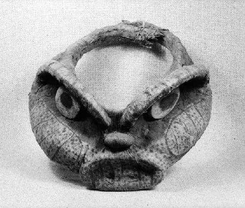 Head-piece in form of animal head covered with bark cloth