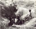 Man and two boys at a waterhole