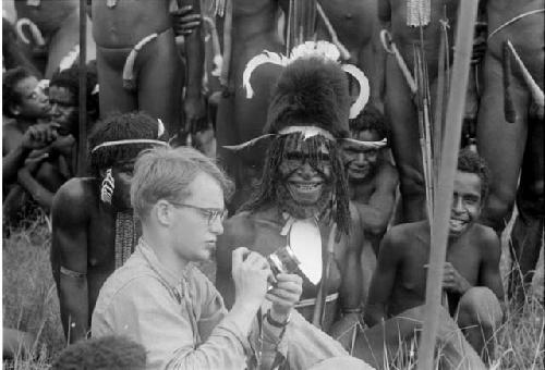 Michael Rockefeller and grinning warrior