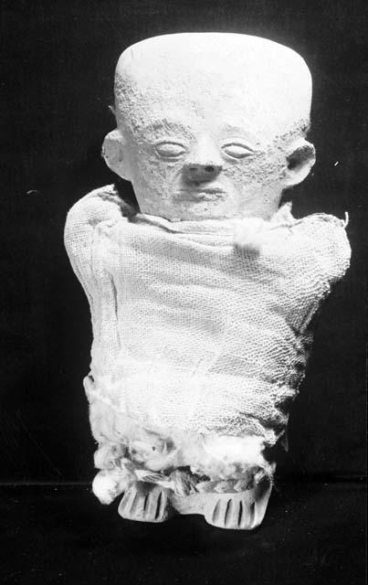 Terra cotta doll with wrappings