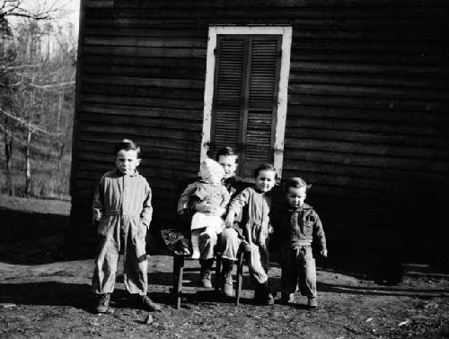 Children posing in front of house on road leading west from old Lynchburg Road