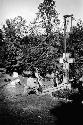 Crew installing gravestone in cemetery