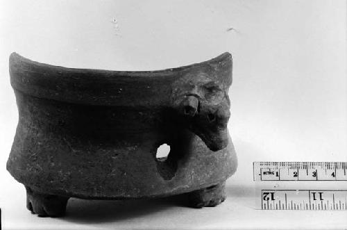 Broken pottery vessel, two legs and bird effigy handle