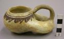 Early modern Hopi black on yellow pottery doughnut-shaped jar