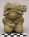 Ceramic figurine of seated female