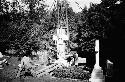 Crew installing gravestone in cemetery