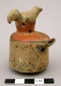 Ceramic figurine whistle, bird whistle on top of cylindrical whistle