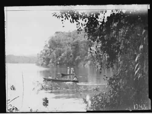 Men in two boats on river (Lake Petha?)