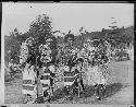 Men dancing and totems