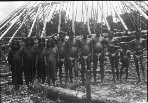 Men in front of half constructed house