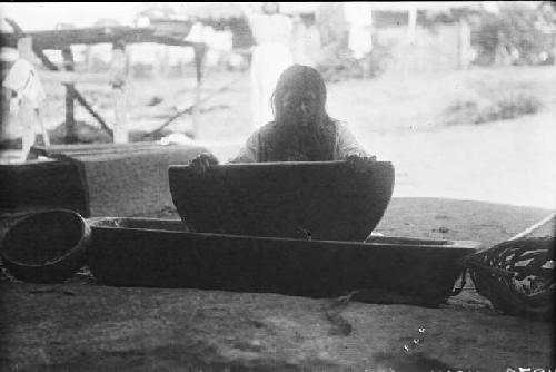 Woman grinding corn