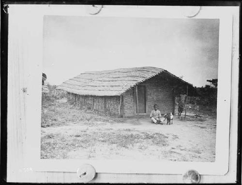 Child and animal in front of building